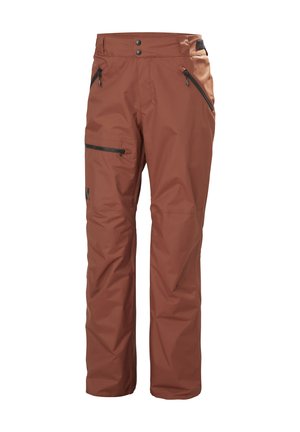Bruine waterdichte broek met een rechte pasvorm. Kenmerken zijn onder andere twee met rits afgesloten zakken en een zijvak, gemaakt van stevig materiaal.