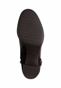 Semelle de chaussure noire avec une texture antidérapante, bout arrondi et accents sur les côtés. Présente un design épuré et inclut un branding au bas. Taille 37.