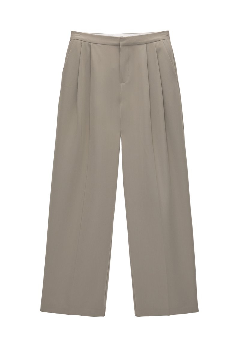 Pantalons beige taille haute à jambes larges avec plis à l'avant et fermeture par crochet et barre, conçus pour un ajustement à la fois décontracté et soigné.