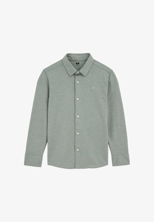 Cămașă verde deschis cu mâneci lungi, realizată dintr-un material moale. Are nasturi în partea din față, guler și un mic logo brodat pe piept.