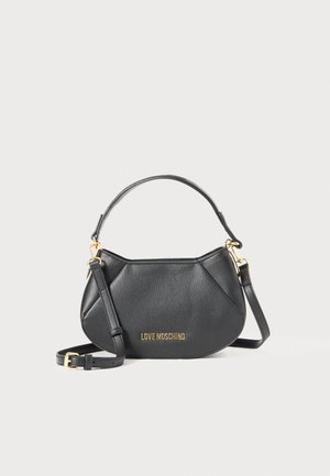 Mustmust mustra, mille ääreline disain, kuldse logoga, lühikese käepideme ja eemaldatava õlalihaga. Tekstuuriga viimistlus, elegantne disain.