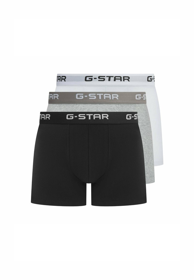 Three pairs of G-Star boxers in black, gray, and white, featuring elastic waistbands with logo. Soft fabric, snug fit, and classic design.