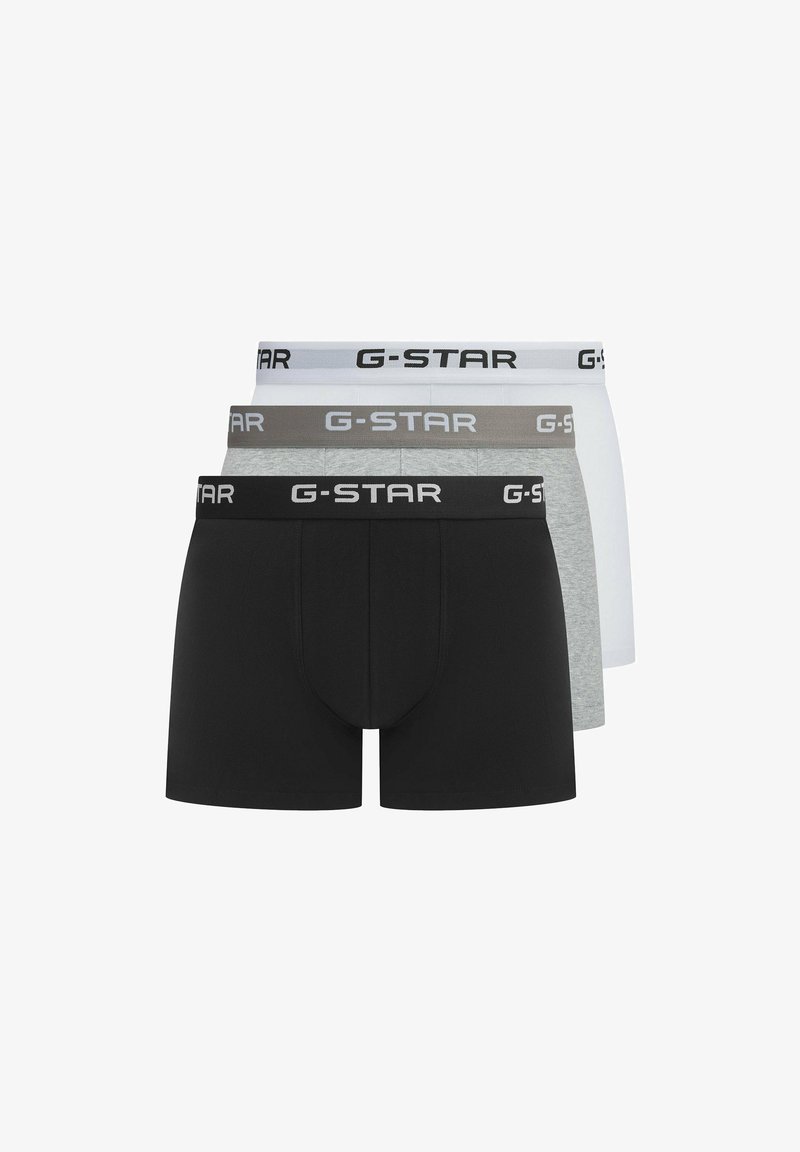 Three pairs of G-Star boxers in black, gray, and white, featuring elastic waistbands with logo. Soft fabric, snug fit, and classic design.
