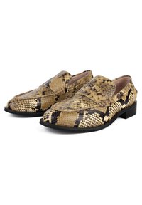 Loafers made of faux snakeskin, featuring a tan and black patterned exterior, rounded toe, and low black heel. Textured surface detail visible.