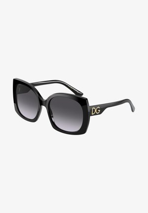 Óculos de sol oversized pretos com lentes degradê. Apresenta uma armação quadrada ousada e o logótipo dourado DG na haste. Acabamento de alto brilho.