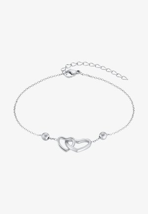 Bracelet en argent avec deux cœurs entrelacés et une perle sphérique, accompagné d'une chaîne délicate et d'un fermoir à pince de homard.