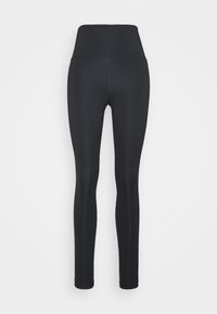 Leggings noirs à taille haute, fabriqués en matériau extensible. Caractéristiques d'une texture lisse et d'un design près du corps, adaptés à une tenue de sport.