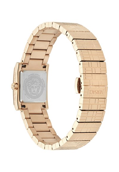 Taisnstūra zelta toņa pulkstenis ar nerūsējošā tērauda siksnu, kurai ir struktūrēts posmu dizains un Medūzas logo detalizācija aizmugurē.