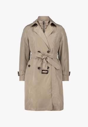 Beżowy płaszcz trencz z paskiem w talii, guziki podwójne i boczne kieszenie. Posiada kołnierz i regulowane mankiety.