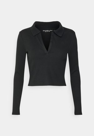 Zwarte ribgebreide top met lange mouwen, een brede kraag en een diepe V-hals, cropped lengte en zachte, gestructureerde stof.