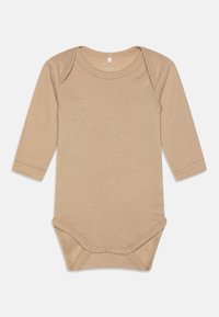 Bodysuit de manga longa em tom bege claro, feito de um tecido macio e elástico. Apresenta um decote redondo e três fechos de pressão na parte inferior.