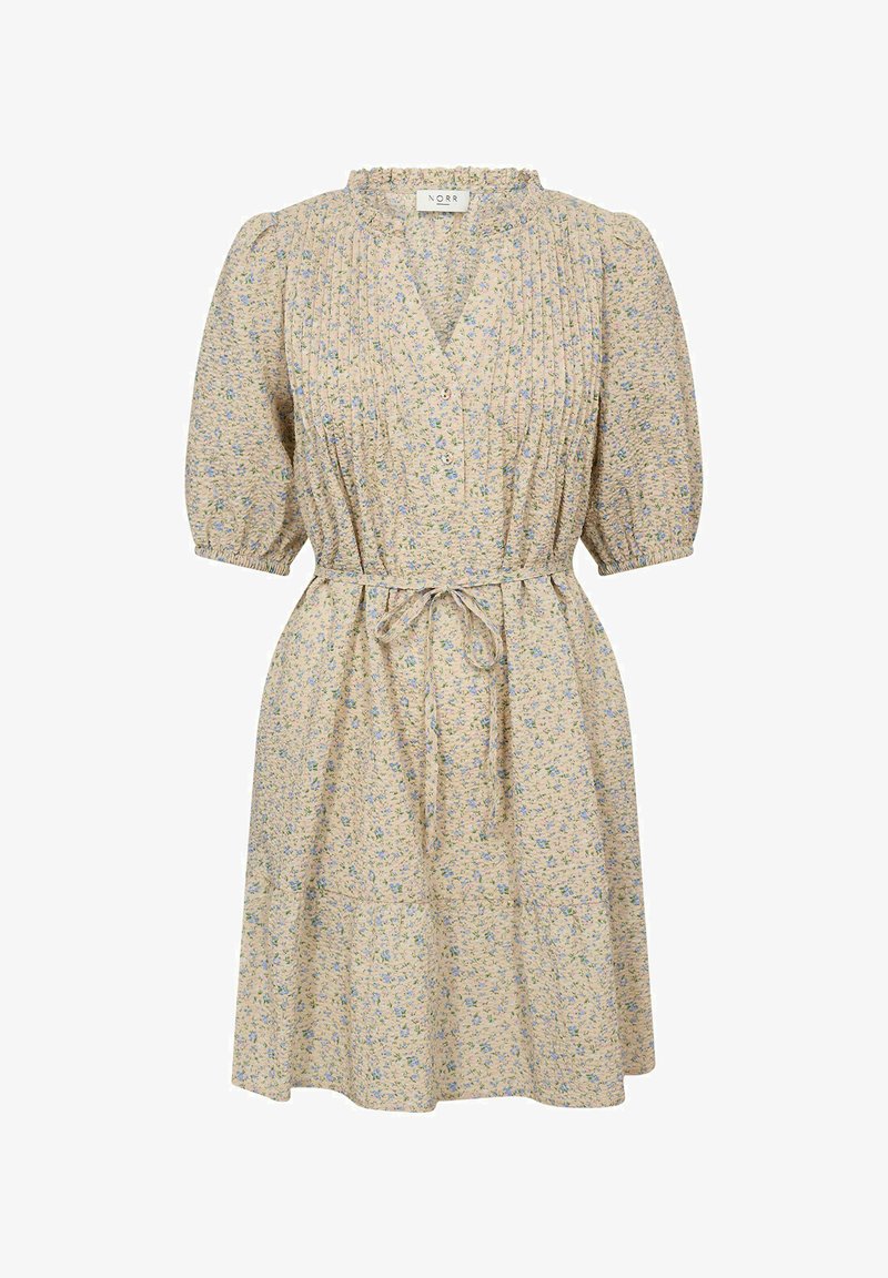 Blommig klänning med beige bas, puffärmar, V-ringning, draperad byst och knytmidja. Har ett ljust blått blommönster genom hela.