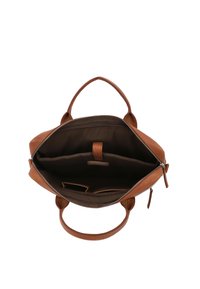Brown leather bag with a zip closure, two handles, and a spacious interior. Includes pockets for organization and a smooth fabric lining.