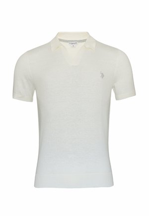 Camisa polo de manga corta en crema claro con cuello en V, puños y dobladillo acanalados, que presenta un pequeño logo bordado en el lado izquierdo del pecho. Textura suave.