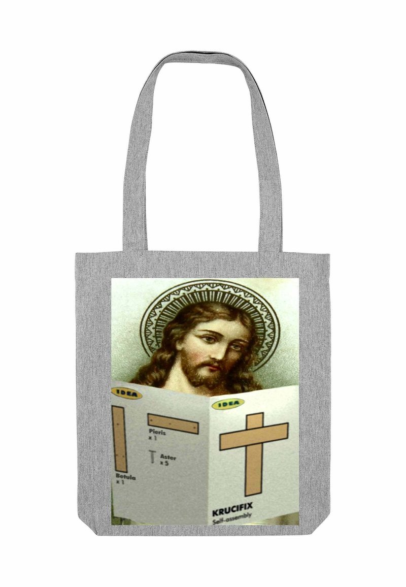 Grijze draagtas met een afbeelding van Jezus met een halo, die montagemanieren voor een houten kruis vast houdt. Tekst in geel en zwart.