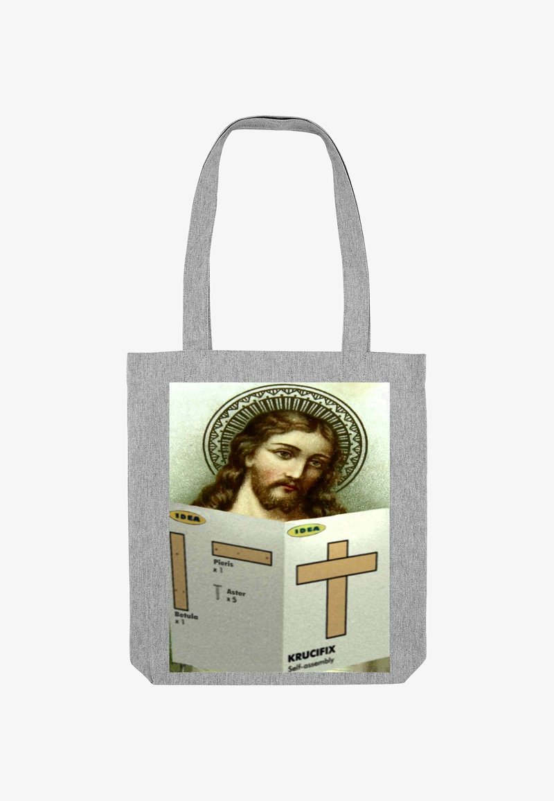 Grijze draagtas met een afbeelding van Jezus met een halo, die montagemanieren voor een houten kruis vast houdt. Tekst in geel en zwart.