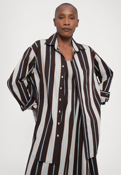 Striped long-sleeve shirt in brown, light blue, and orange; features a button-up front, relaxed fit, and a classic collar.