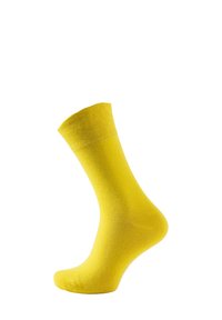 Gelbe Knöchelsocke aus weichem, glattem Stoff. Röhrenform mit geripptem Bündchen und nahtlosem Zehendesign. Gleichmäßige Farbe in der gesamten Socke.