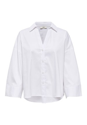 Chemise blanche à manches longues avec boutons, larges poignets, col en V et ourlet légèrement arrondi.