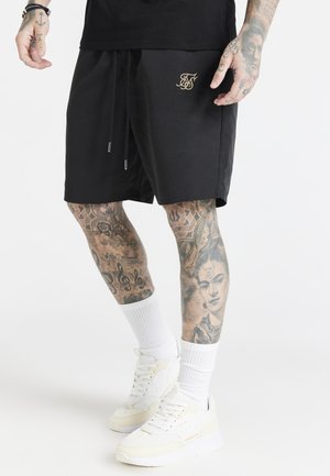 DIVISION - Pantaloni sportivi - black