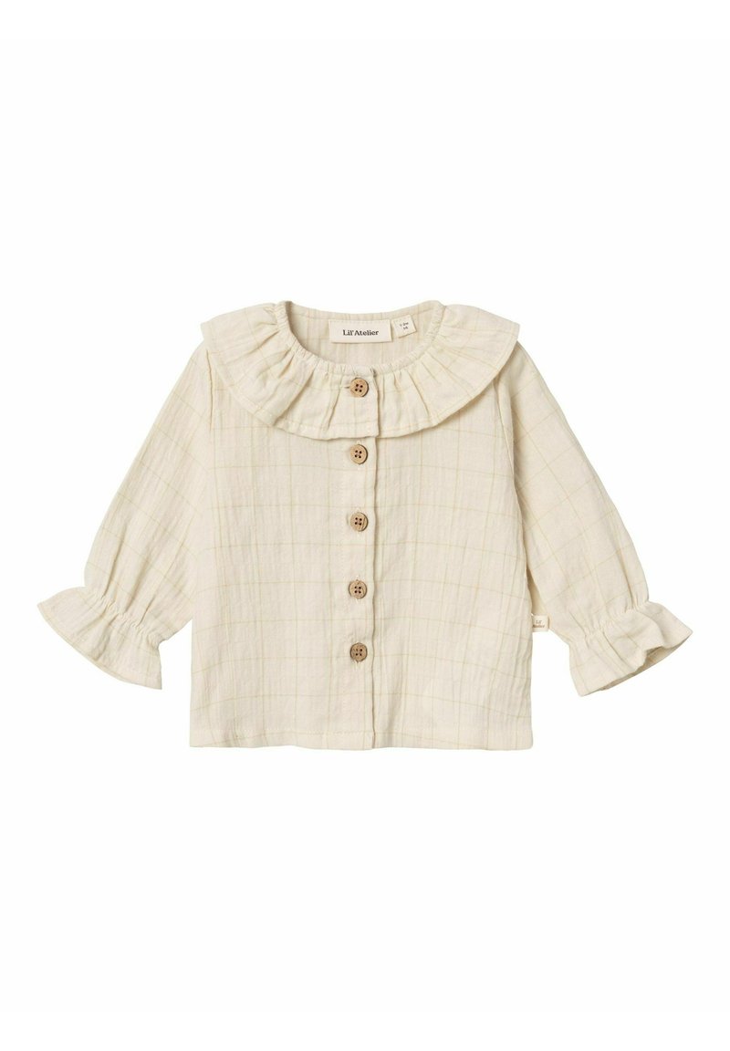 Camicia button-up beige chiaro con colletto arricciato, maniche lunghe con polsini svasati e motivo a trama a scacchi. Cinque bottoni in legno sulla parte anteriore.