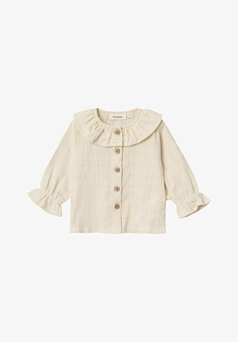 Camicia button-up beige chiaro con colletto arricciato, maniche lunghe con polsini svasati e motivo a trama a scacchi. Cinque bottoni in legno sulla parte anteriore.