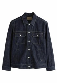 Mørkeblå denimjakke med knaplukning foran, to brystlommer, sidelommer og kontrasterende gul syning. Har en klassisk krave.