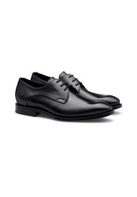 Chaussures habillées en cuir noir avec une texture lisse, un bout arrondi et des détails de couture subtils. Talon bas et design à lacets.