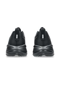 Black athletic shoes featuring a textured fabric upper, rounded heel, and a rubber sole with a wavy pattern. Two pull tabs for easy fitting.