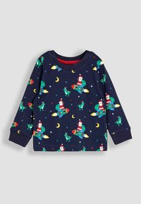 Camisa de manga larga de color navy con patrones coloridos de cohetes, dinosaurios y Santa sobre un fondo estrellado. Material de algodón suave con puños acanalados.