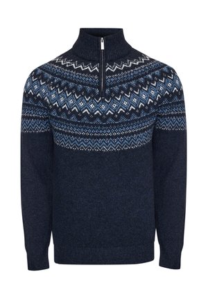 Námořnický pletený svetr s vysokým límcem, zipem vpředu a vzorem fair isle v modré a bílé barvě na hrudníku a ramenou.