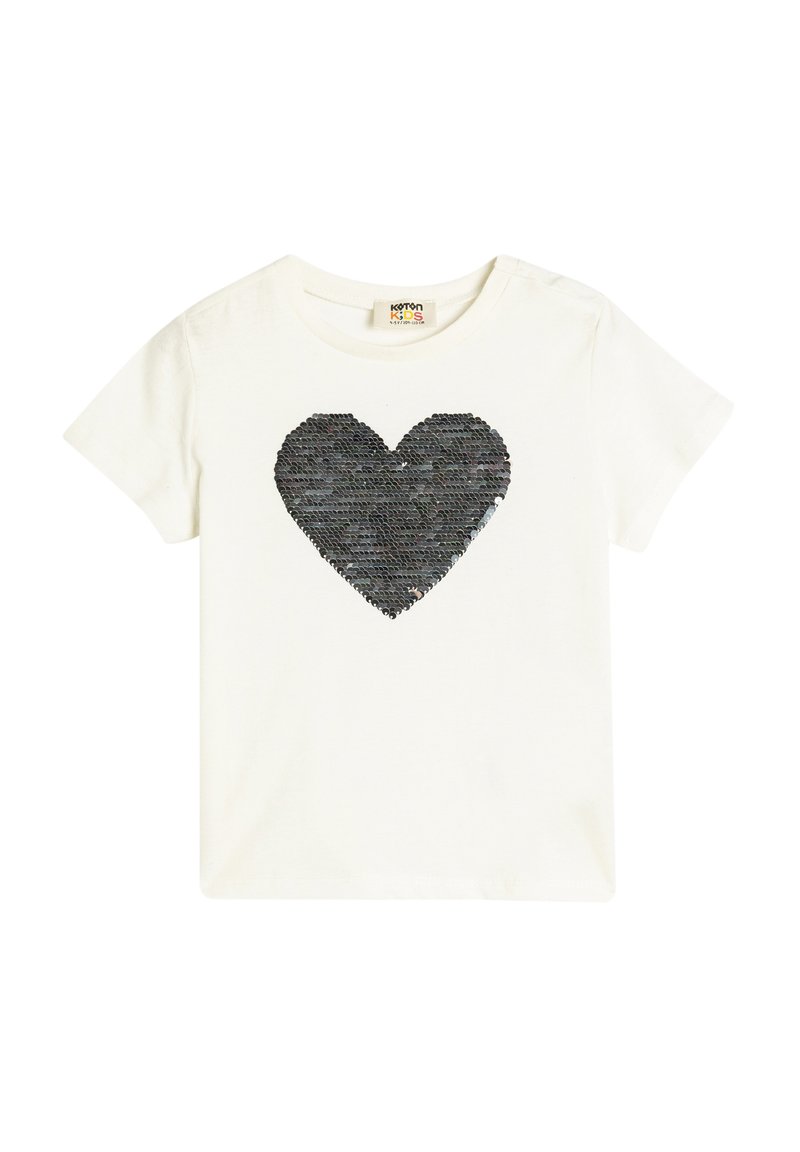 Weißes Baumwoll-T-Shirt mit einem großen, schwarzen, mit Pailletten besetzten Herzdesign in der Mitte. Kurze Ärmel und ein Rundhalsausschnitt.