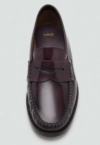 Burgundy leather loafers with a smooth finish, decorative stitching, and a band across the top featuring a cutout detail.