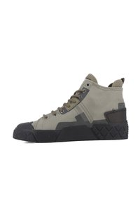 High-top sneakers in earthy green canvas with a black rubber toe cap and textured sole. Features metal eyelets and a rear pull tab.