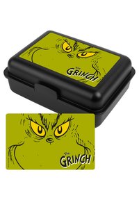 Lunch box nero con coperchio verde che presenta il viso di un Grinch in stile cartone animato e occhi gialli. Include un biglietto abbinato con lo stesso design.