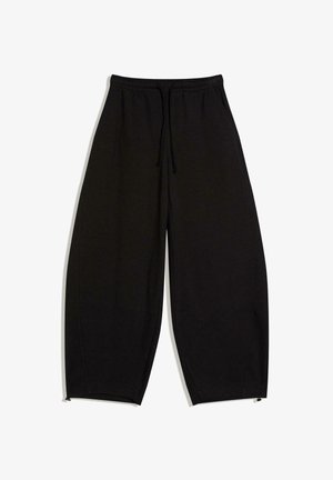 Schwarze weite Hose mit elastischem Bund und Kordelzug, ausgestattet mit verstellbaren Säumen an den Knöcheln.
