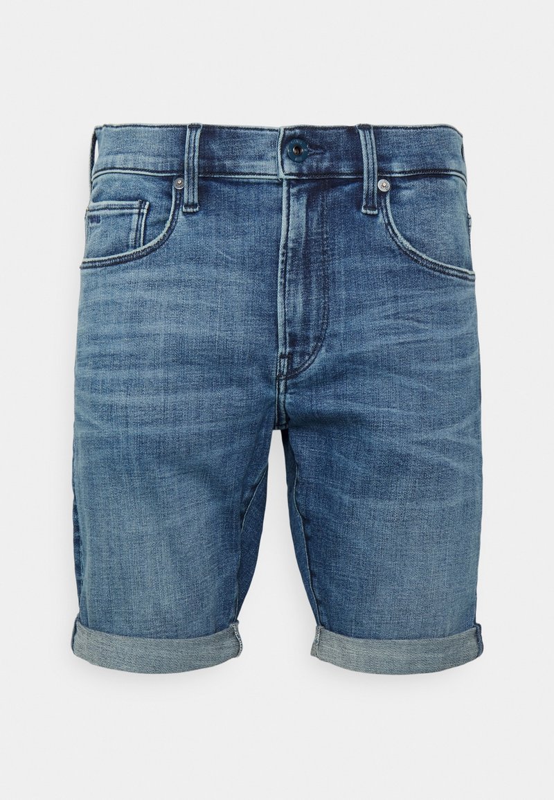Jeansshorts i medelblå tvätt, med en standardpassform, rullade manschetter, fem fickor och kontrasterande sömmar. Hållbart tyg med subtil struktur.
