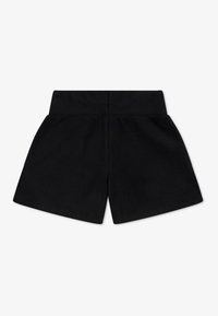 Schwarze Baumwollshorts mit weicher Textur, ausgestattet mit einem elastischen Bund und einem lockeren Schnitt. Das Design ist schlicht, ohne zusätzliche Muster oder Akzente.