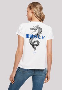 White cotton t-shirt featuring a large black dragon graphic and blue Japanese text on the back. Short sleeves and relaxed fit.