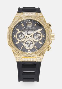 Orologio ottagonale color oro con quadrante nero e cinturino in gomma. Presenta dettagli in strass, sub-quadranti cronografici e indici delle ore audaci.