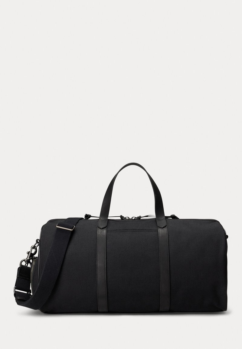Geantă duffel neagră din material textil, cu accente din piele. Dispune de mânere superioare și o curea de umăr detașabilă. Textură netedă, formă rectangulară.