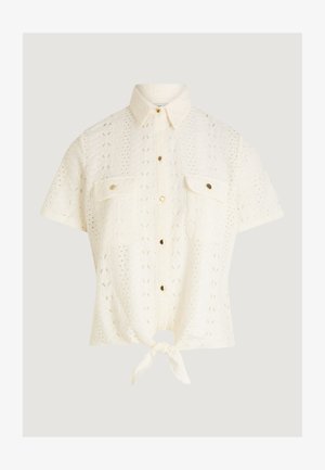 Krátký rukáv krémové pletené halenky s límečkem, zapínáním na knoflíky vpředu, náprsními kapsami a zavázaným uzlem na lemu.