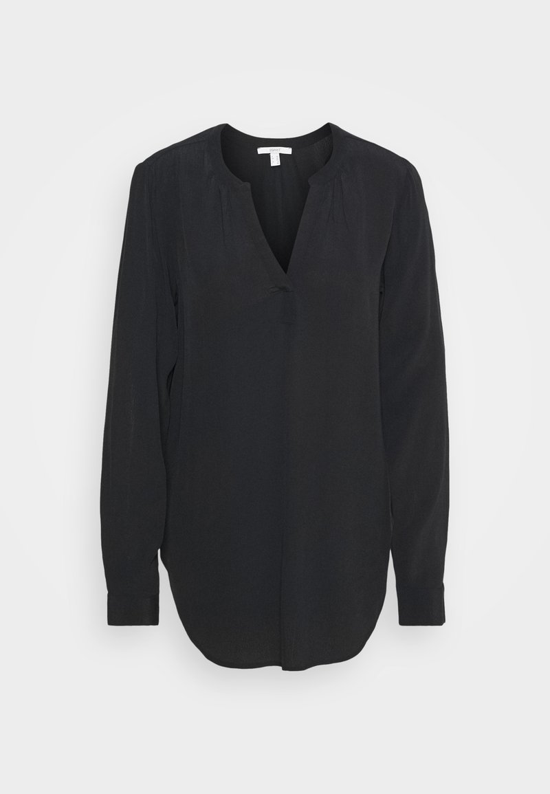 Blusa negra de manga larga con escote en V, fabricada en tejido suave, de corte holgado y con detalles fruncidos en los hombros. El dobladillo es redondeado y las mangas tienen puños.