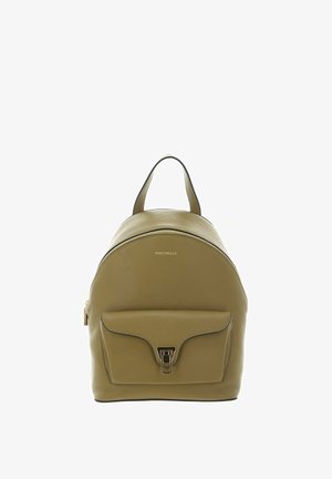Olive green leather backpack with front flap pocket, gold-tone clasp, top handle, and zipper closure, labeled "Coccinelle."