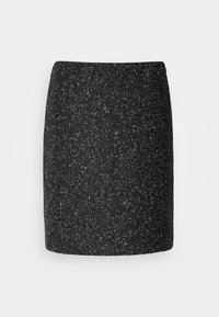 Jupe en tweed noir et blanc jusqu'au genou avec un motif chevron subtil et une silhouette droite.