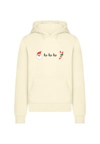 Crème-kleurige hoodie met een voorzak. Bevat een afbeelding van het gezicht van de Kerstman en de tekst "ho ho ho," naast een illustratie van een zuurstok.