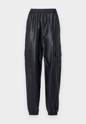 Black cargo pants made of glossy synthetic material, featuring an elastic waistband, tapered cuffs, and two side cargo pockets.
