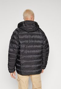 Tommy Jeans HOODED JACKET  - Páperová bunda - black