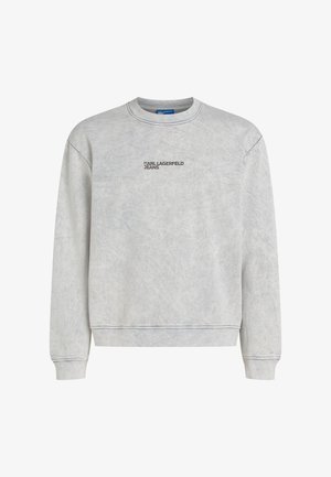 Harmaa collegetakki pehmeästä kankaasta, jossa on pyöreä pääntie, resorit hihansuissa ja helmassa sekä musta "KARL LAGERFELD JEANS" -logo edessä.