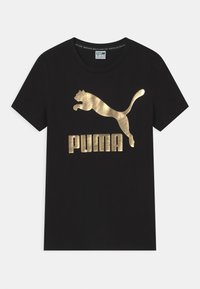 Must väljandiga must puuvillane T-särk, mille esipaneelil on metallik kullast Puma logo ja hüppava puma siluett, ümar kaelus, lühikesed varrukad.